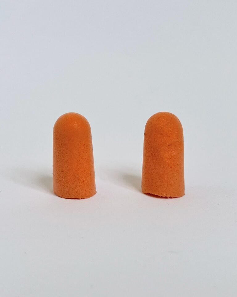 Bright orange, plain, unmistakably built for a construction site rather than a wellness shelf.