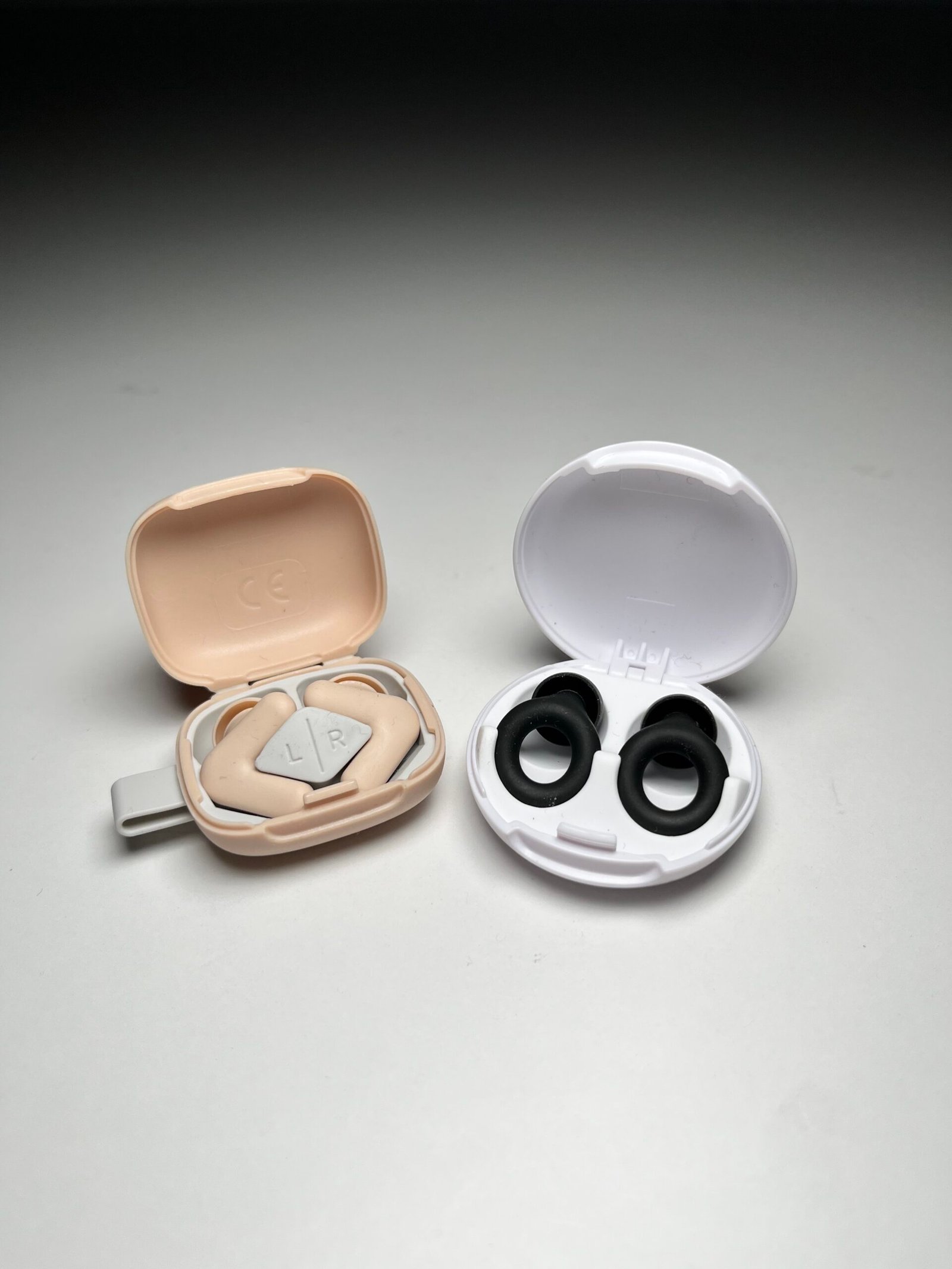 Loop Quiet 2 and Alpine Silence earplugs side by side on a neutral surface